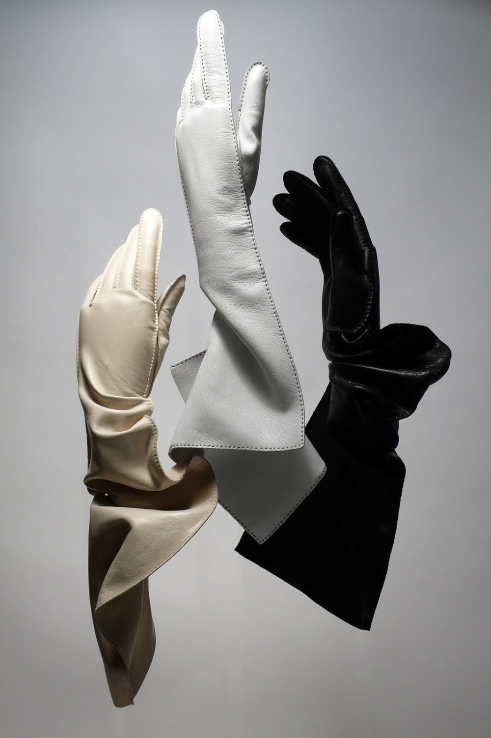 Women's sculptural gloves trio.