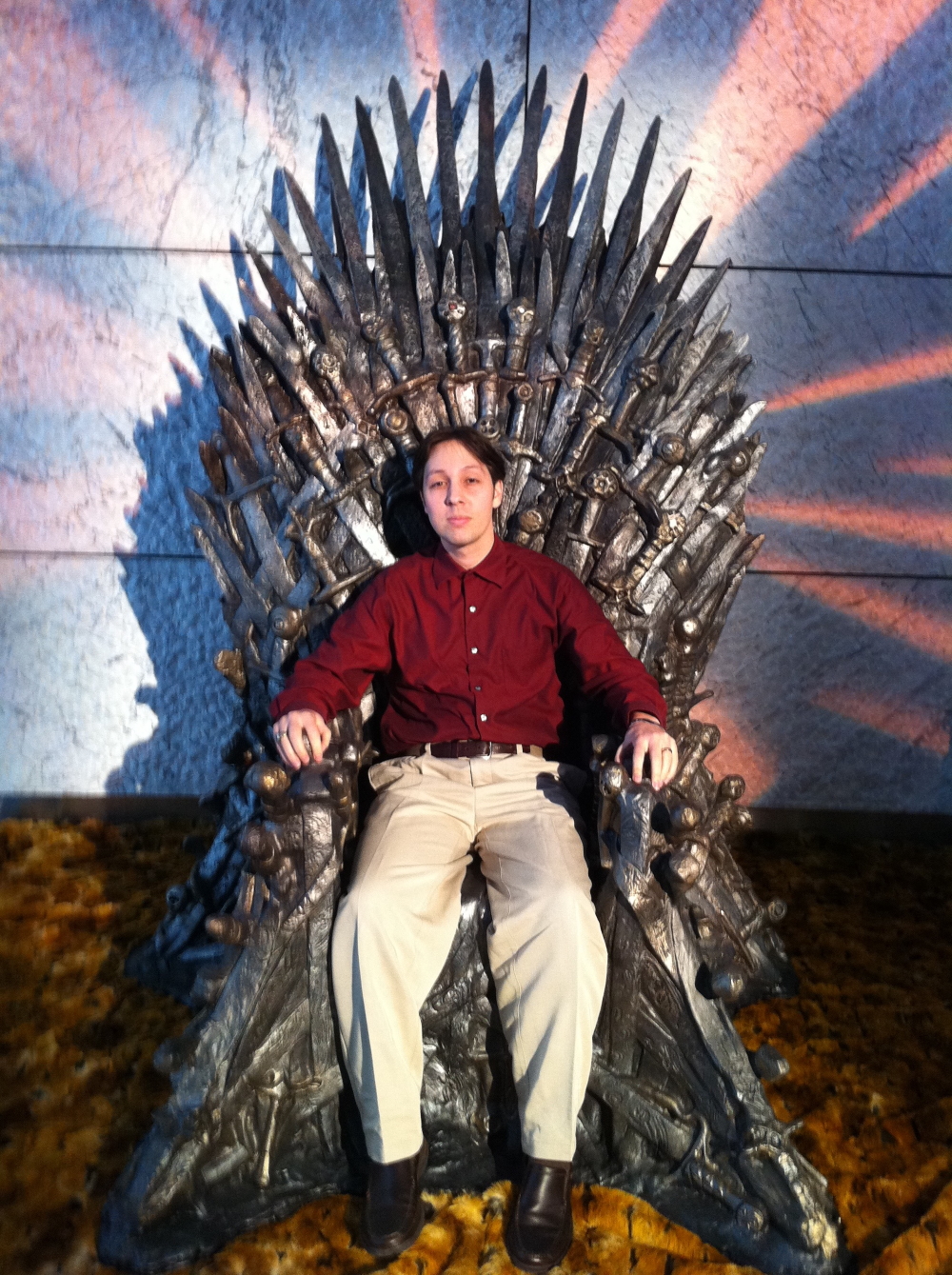 'Game of Thrones': language creator David J. Peterson sitting in the famous iron throne of the famous fantasy tv series..