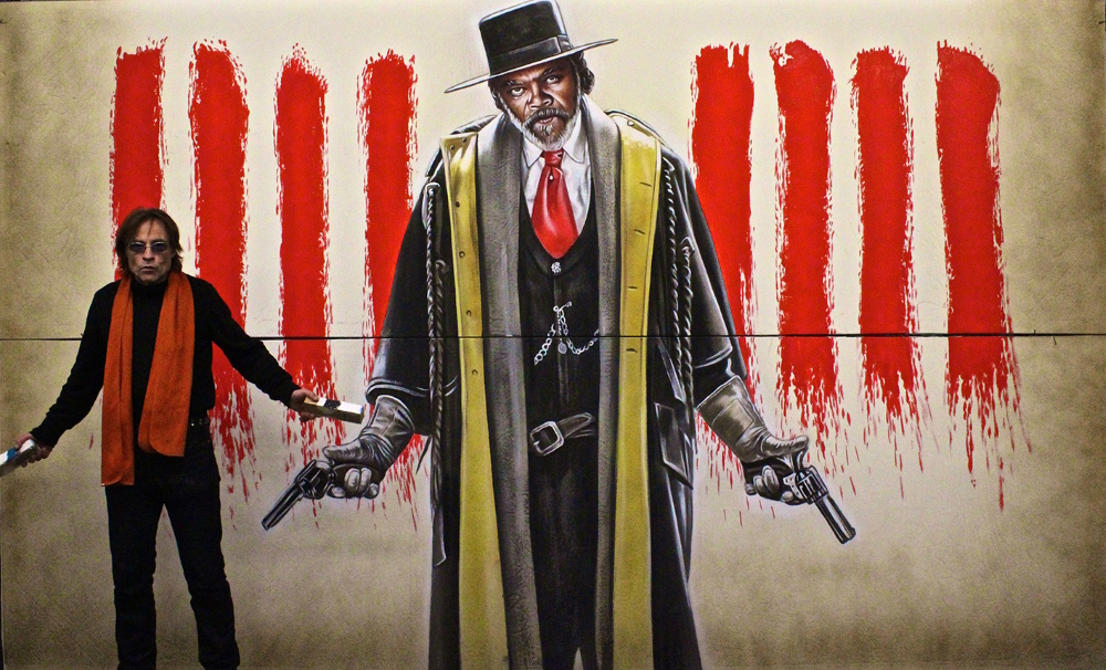 'The hateful eight': the artist posing next to Samuel L. Jackson on his billboard for Quentin Tarantino's 2015 American Western mystery thriller film.