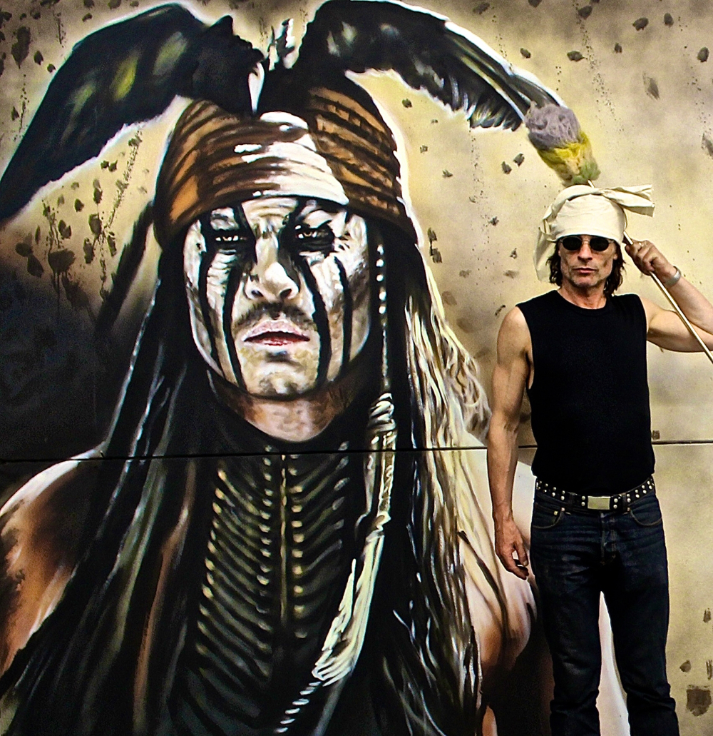 'The lone Ranger': Goetz Valien besides Johnny Depp in front of his billboard for the 2013 American action Western film.