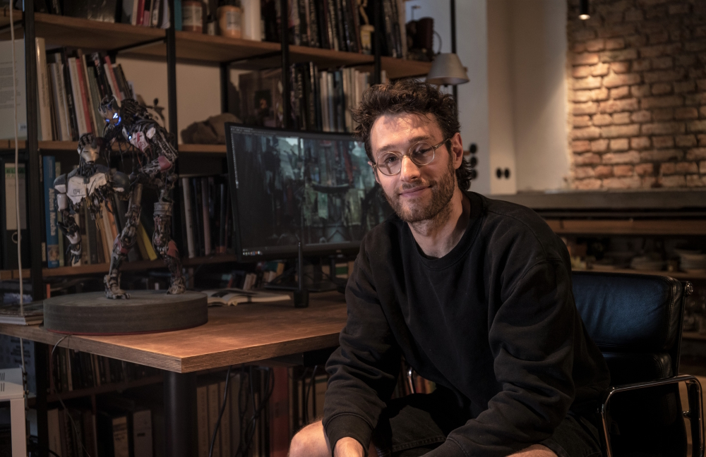 Luis Guggenberger beside the sulpture 'Avengers: Age Of Ultron'.