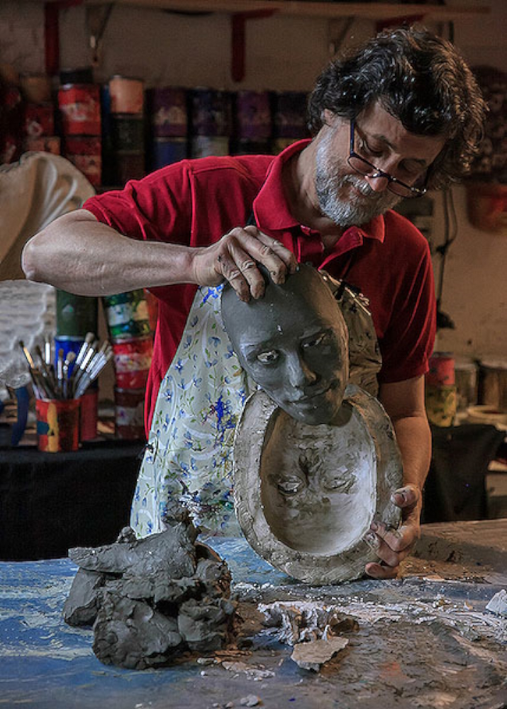 Mario Belloni in his workshop sculpting the clay model for his masks - each of them unique!