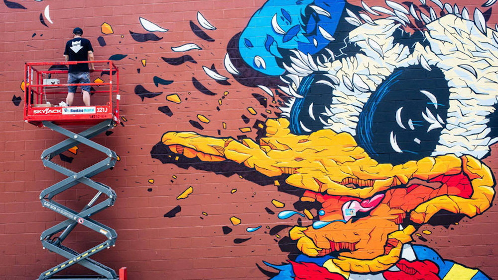 Matt Gondek at work on mural of 'Donald' in Atlanta
