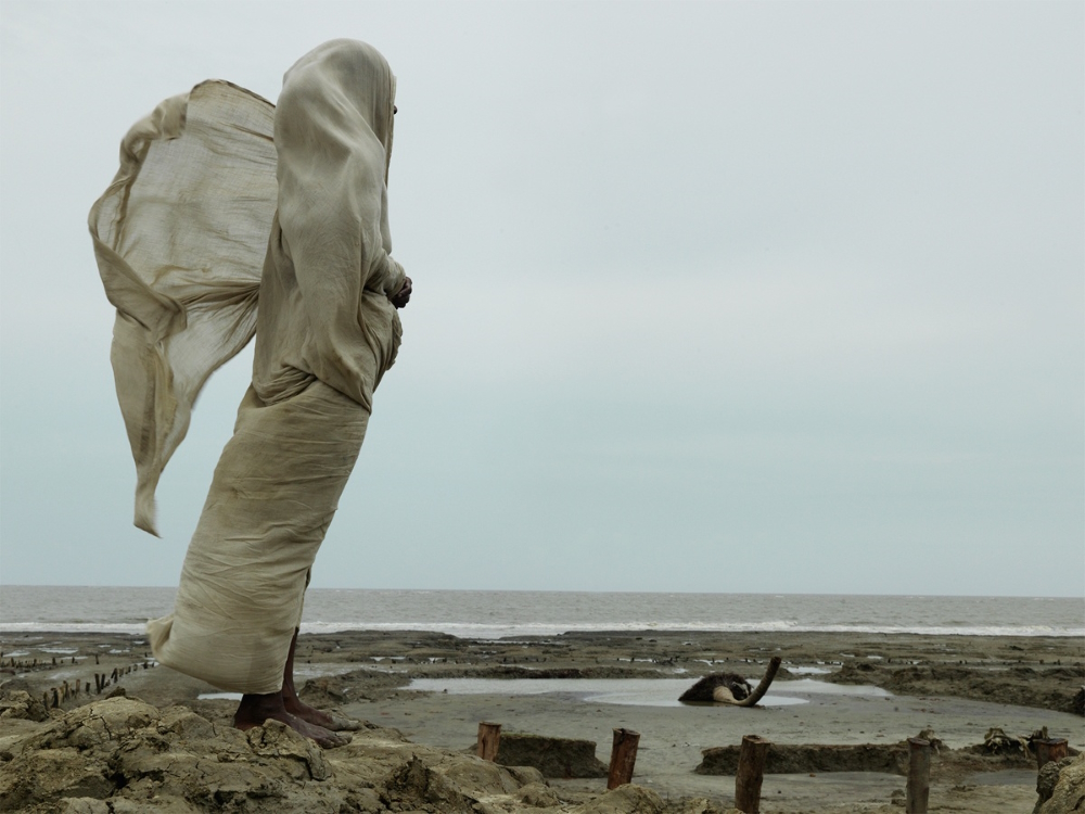 Widow Kanaklata Das stares at the sea waiting for her husband to return after Cyclone Aila. He never returned. (From 