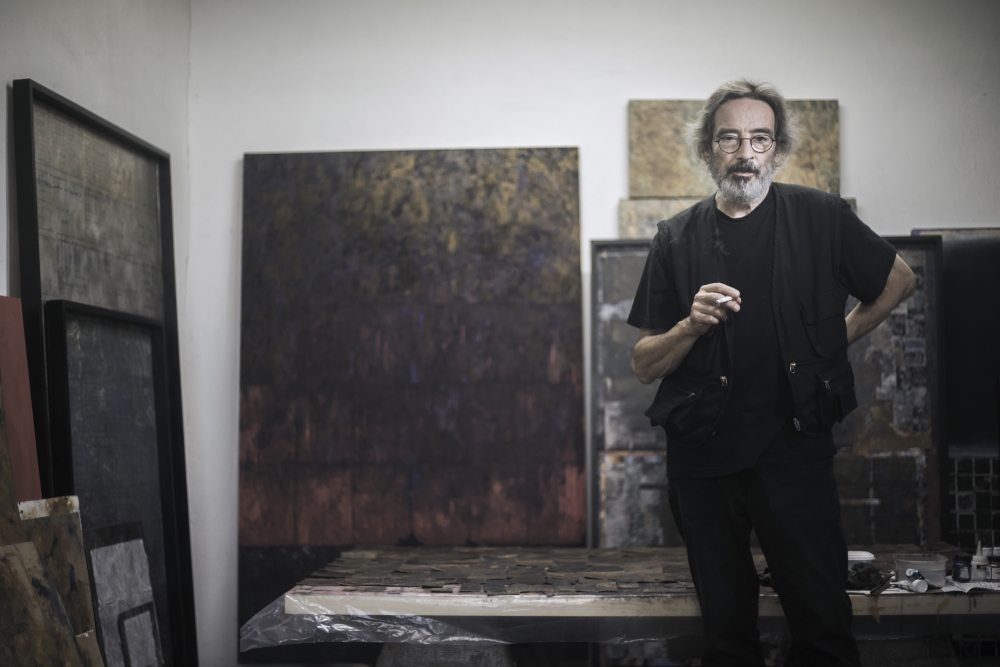 Art for art's sake: Russell Mills in his studio surrounded by some of his artworks.