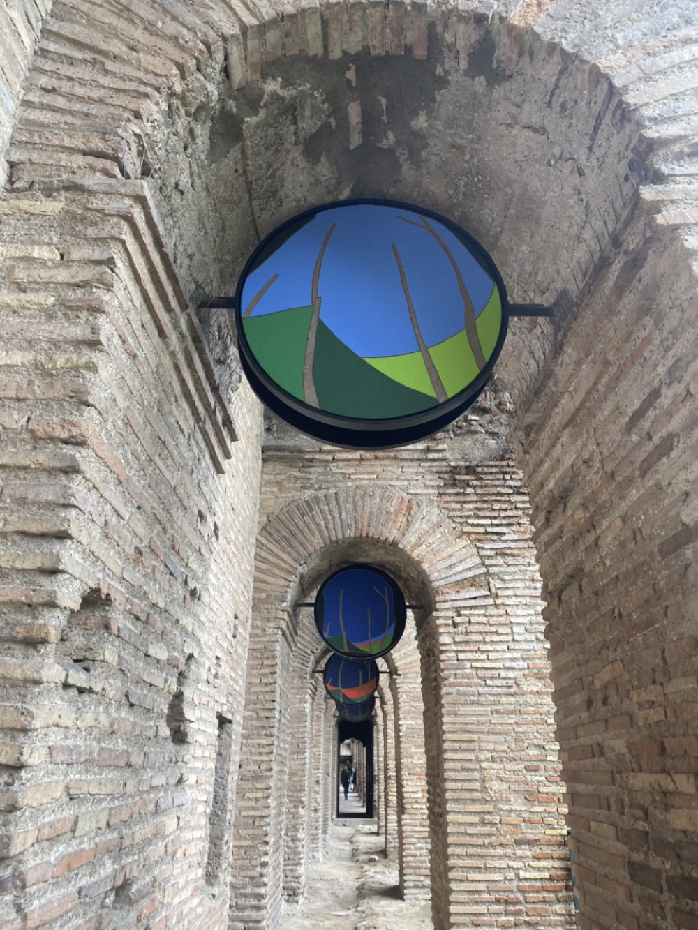 'Un giorno alle mura romane: ore 16:00' on display at Rome's Museo dello Mura. The roundels (tempera on panel) 